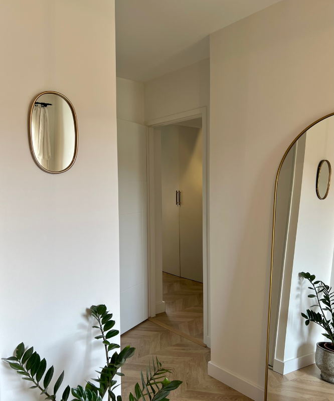 Miroir mural ovale doré