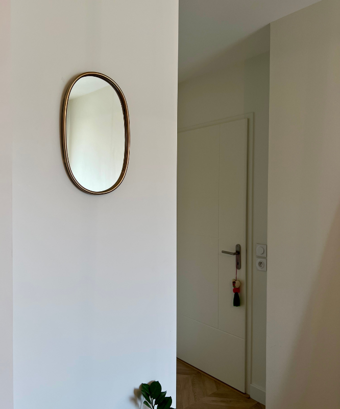 Miroir mural ovale doré